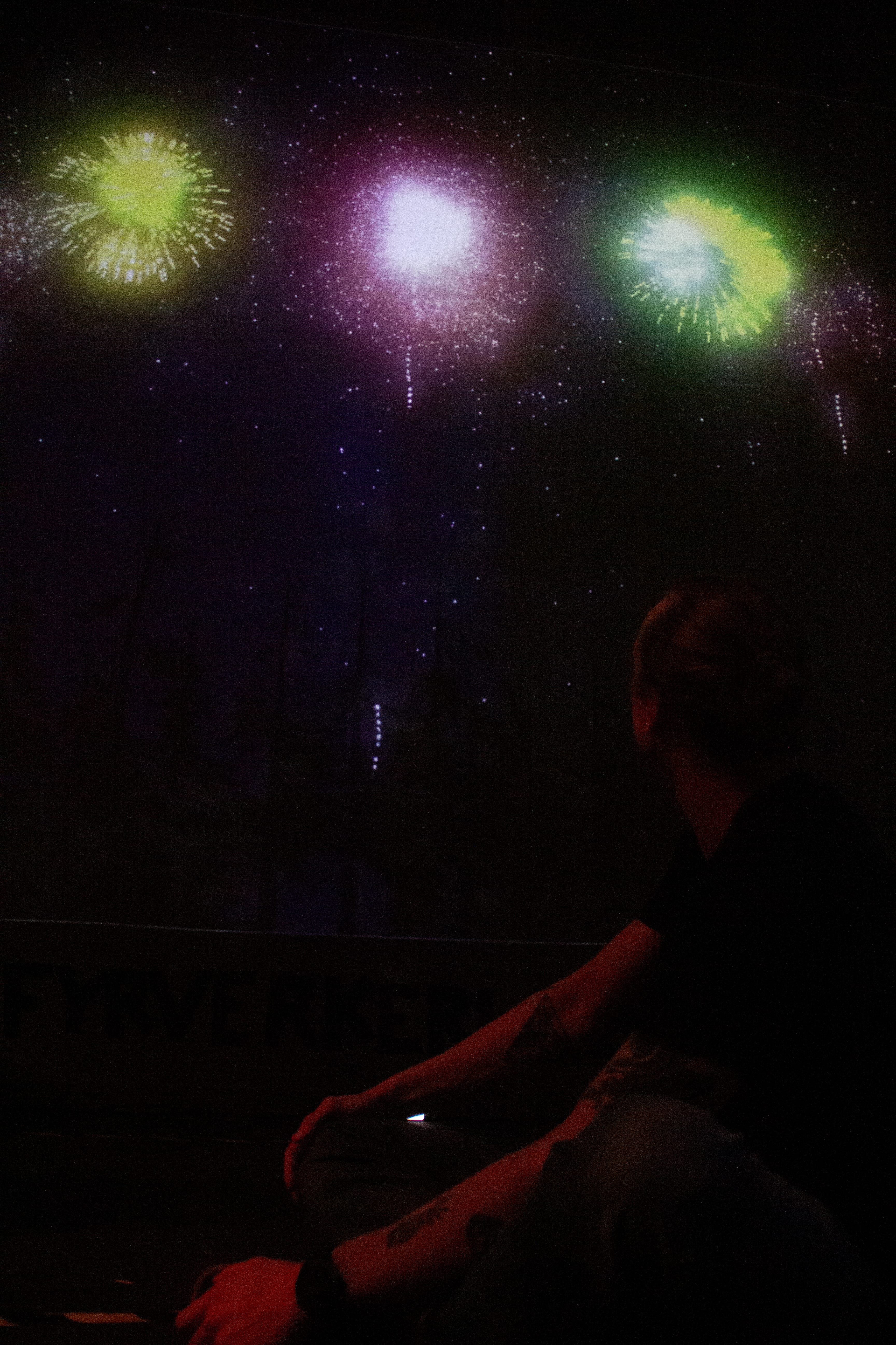 Visitors launching fireworks at the installation